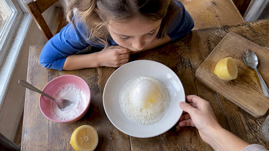 Child watching lemon volcano fizz