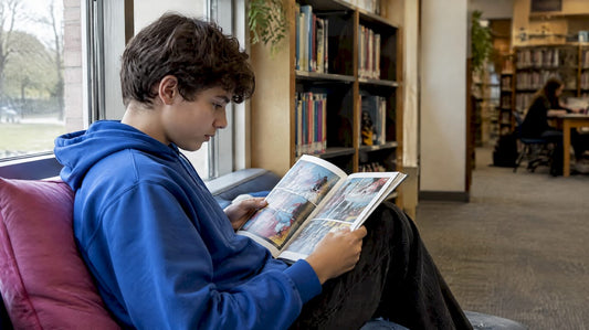 Teenager absorbed in a science comic